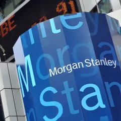A blue, hexagonal pillar displays the "Morgan Stanley" logo. In the background, an orange digital ticker shows "ADBE" and "91".
