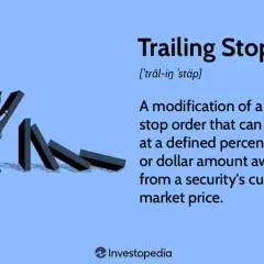 A person sets up dominoes, illustrating the concept of a trailing stop loss to protect investments.