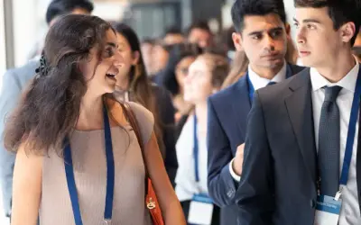 Young professionals attend a Morgan Stanley Next Level Fund event, networking and discussing future opportunities.