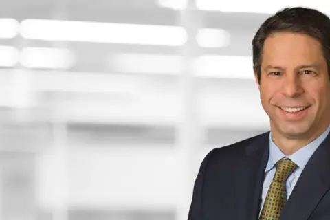 Dan Simkowitz, a leader at Morgan Stanley, smiles in a professional portrait.