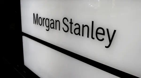 Black 3D letters spell "Morgan Stanley" on a white illuminated panel, suggesting a gateway to Morgan Stanley access investing.