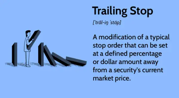 A person sets up dominoes, illustrating the concept of a trailing stop loss to protect investments.