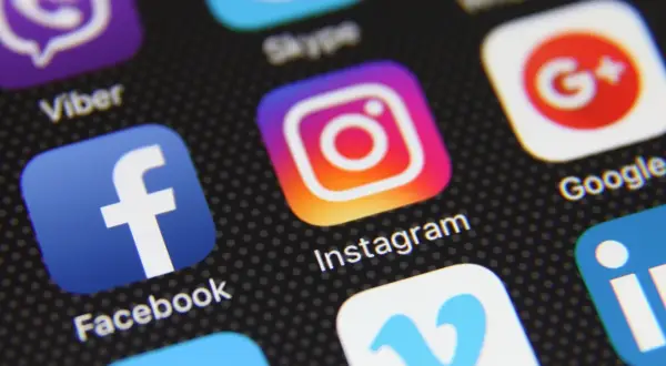 Close-up of a smartphone screen displaying various social media app icons, including Instagram, Facebook, and Viber. This image could represent the diverse digital landscape, much like a "vox etf" offers a diversified investment.