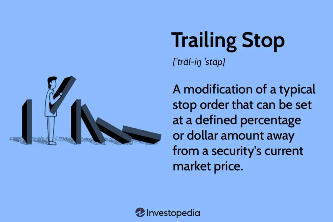 A person sets up dominoes, illustrating the concept of a trailing stop loss to protect investments.