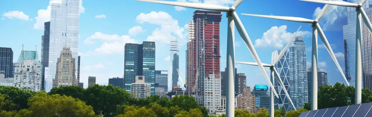 Wind turbines and solar panels blend with a city skyline, symbolizing a sustainable future and Morgan Stanley ESG initiatives.