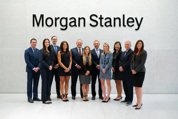 A diverse team of professionals stands in front of the "Morgan Stanley" logo, likely discussing complex financial instruments like Morgan Stanley CDS.